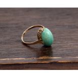 A 9ct gold and hard stone cabochon ring. 2.3g Size L