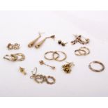 A collection of 9ct and yellow metal earrings. 8.5g
