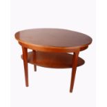 A teak and laminate oval 2 tier side table