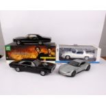 Three boxed 1:18 scale film related cars to include a Greenlight 1970 Dodge Charger from Fast &