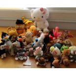 A collection of 27 TY Beanie Babies with tags along with a Build-a-Bear Hello Kitty and four