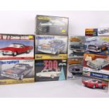 A collection of ten various cars build kits from Revell, Hornby, AMT and Minicraft. Cars include: