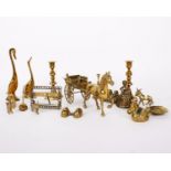A collection of brass objects to include a horse and carriage.