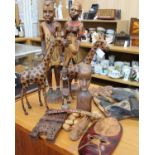 A collection of African carved wooden decorative ornaments.