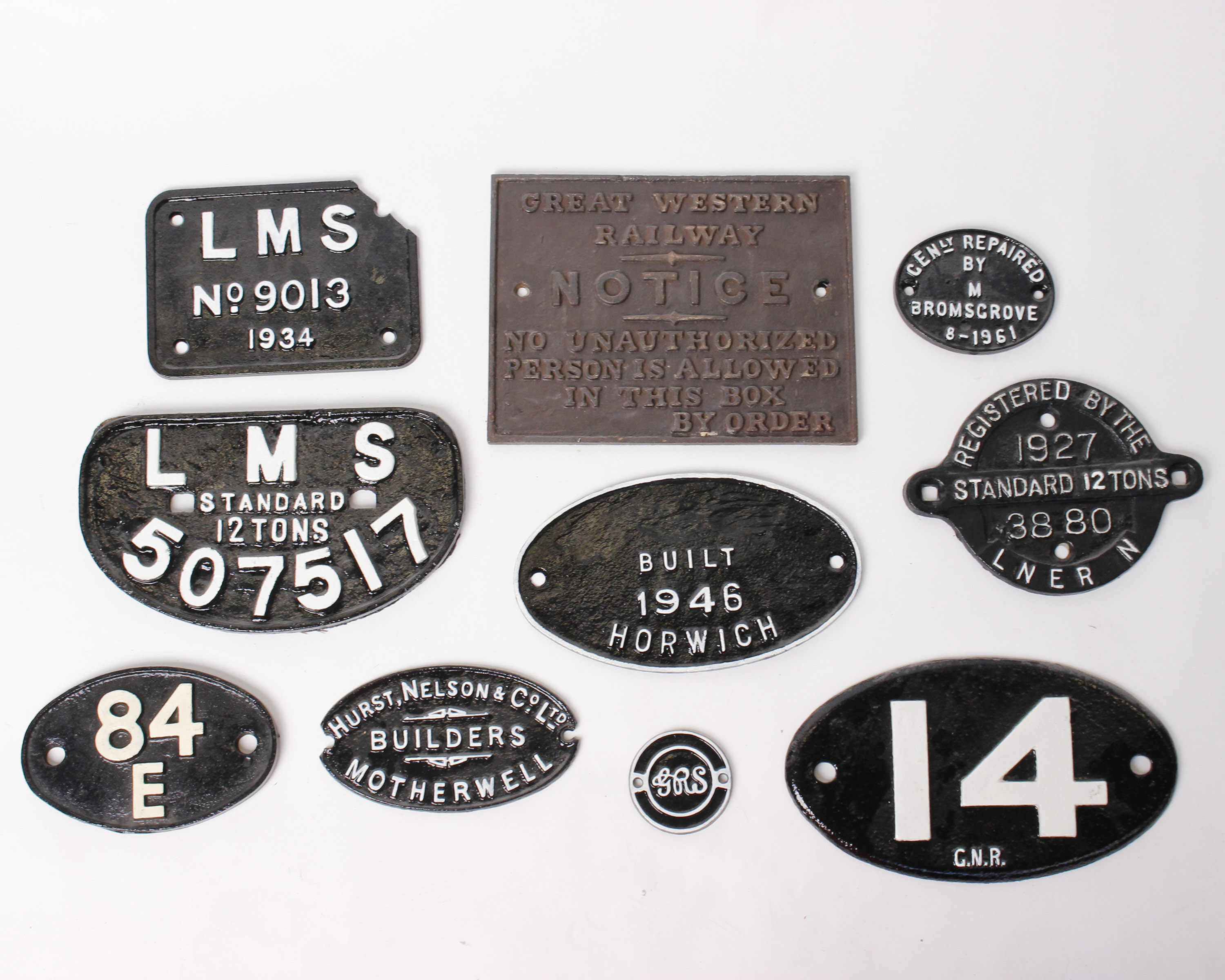 A collection of cast iron signs and plaques from L.M.S and Great Western Railway. To include