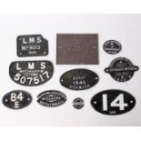 A collection of cast iron signs and plaques from L.M.S and Great Western Railway. To include