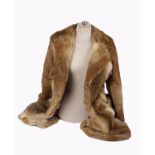 A ladies Immaculate fawn coloured rabbit fur coat, size 14, a ladies black fur coat, size medium and