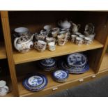 A Collection of Dinner Ware - One blue and white set and one gold Imari set with additional pieces