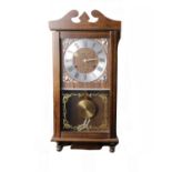 An Early 20th Century 'President' 31 Day Wall Clock in Wooden CaseKey included.