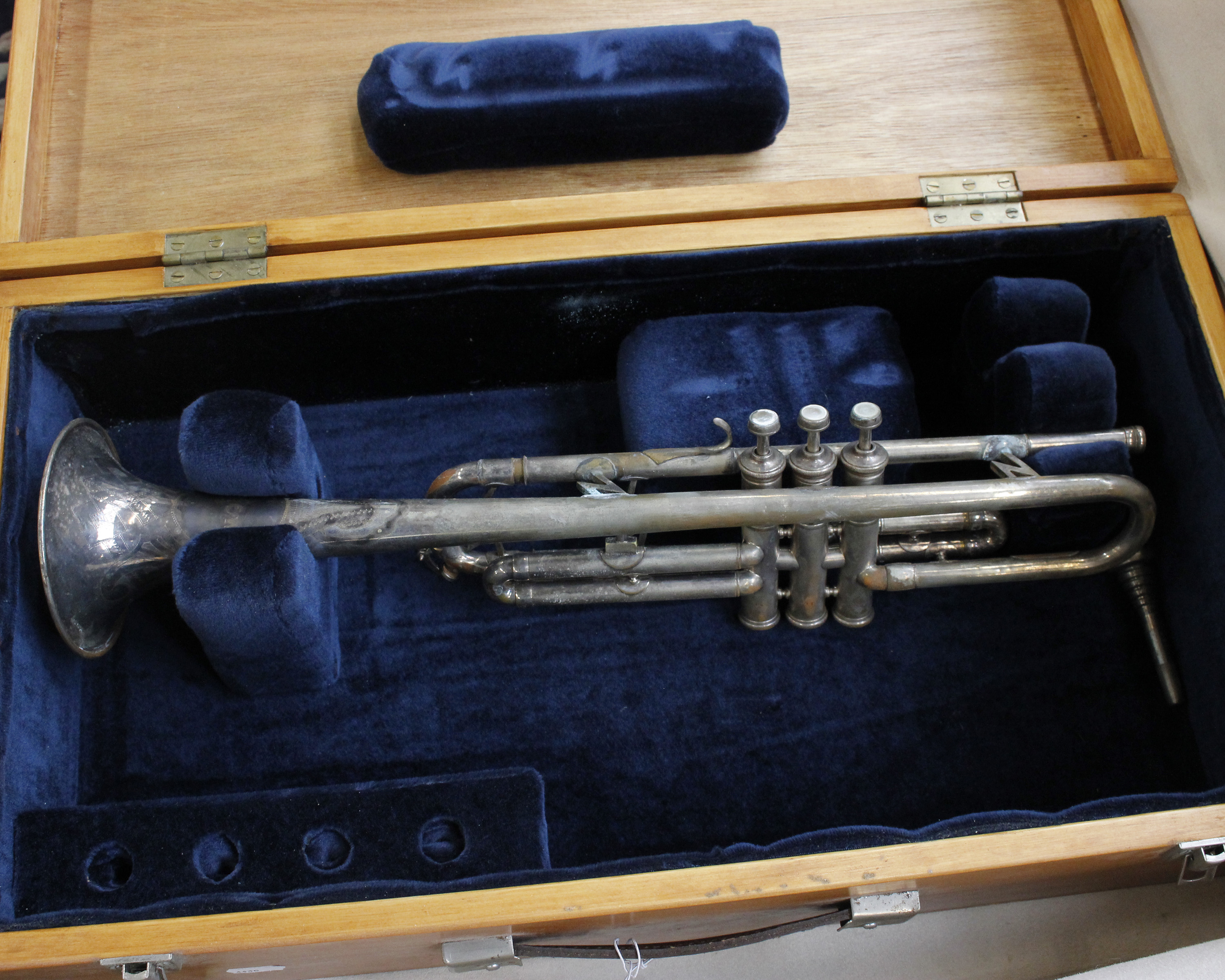 A nickel plated trumpet with velvet lined wooden carrying case, stamped made in Czechoslovakia.