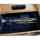 A nickel plated trumpet with velvet lined wooden carrying case, stamped made in Czechoslovakia.
