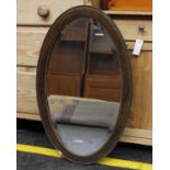 Oval wood framed bevelled mirror 78cm(H) 47cm(W)