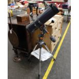 A Celestron Astro Master 130 telescope with instructions