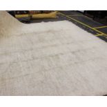 A large modern deep pile woollen carpet in cream. 340cm x 315cm.