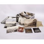 A collection of early 20th century glass photographic negative slides, many produced by HE