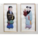 An oriental silk picture of four figures together with another smaller and a framed wood block
