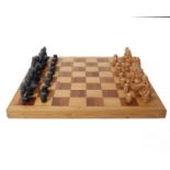 A Medieval Themed Chess Set by Berkeley Chess with wooden board.