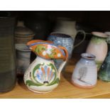 A collection of stoneware and studio pottery items