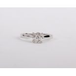 White gold ring set with single round head. Invisible set diamonds, nine in total spreading 1ct
