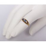 An unmarked yellow metal sapphire and diamond ring. One sapphire vacant. 2.9g. Size P