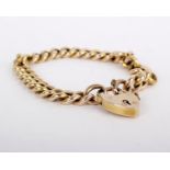 A 15 carat gold curb link bracelet, composed of polished curb links to a padlock clasp, stamped