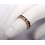 A yellow metal gem set full eternity ring(some vacant stones) 2.3g Size M
