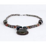 A white metal and hard stone pendant bead necklace. 85g.