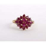 A 9ct gold ruby ring set with a cluster of various cut rubies