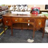 A Regency string inlaid mahogany bow fronted sideboard, the central drawer flanked with two cabinets