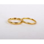 A 22ct plain polished band gold ring, stamped 22 with full Birmingham hallmarks, size N; and a