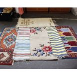 A collection of nine rugs
