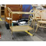 A mid century tea trolley with lift out veneered tray top, 77(H) x 81(W) x 41(D)cm.