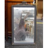 A wooden and metal framed mirror