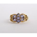A 9ct gold amethyst ring, set with a cluster of oval cut amethysts, stamped 375 with Birmingham