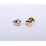 A pair of 18ct gold and diamond ear studs. Each set with 3mm brilliant cut diamond in a collar