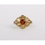 A 9ct gold citrine ring, set with a cluster of circular cut citrines, stamped 375, size N 1/2, 2.8g