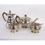 A sterling silver tea set comprising a coffee pot, a tea pot , a milk jug and sugar bowl - marked to