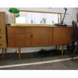 A Mid Century Teak Sideboard With three drawers and two sliding doors(H)74 x (W)151 x (D)41 cm