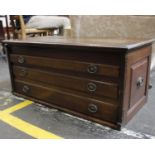 An Early 20th Century Oak Low Line Three Drawer Chest of Drawers With lift-up top and handles on the