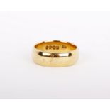An 18ct gold ring the plain polished band