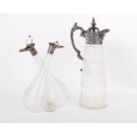 Sterling silver topped oil and vinegar carafe plus a white metal topped glass water jug