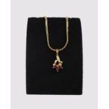 An 18ct gold ruby and diamond pendant