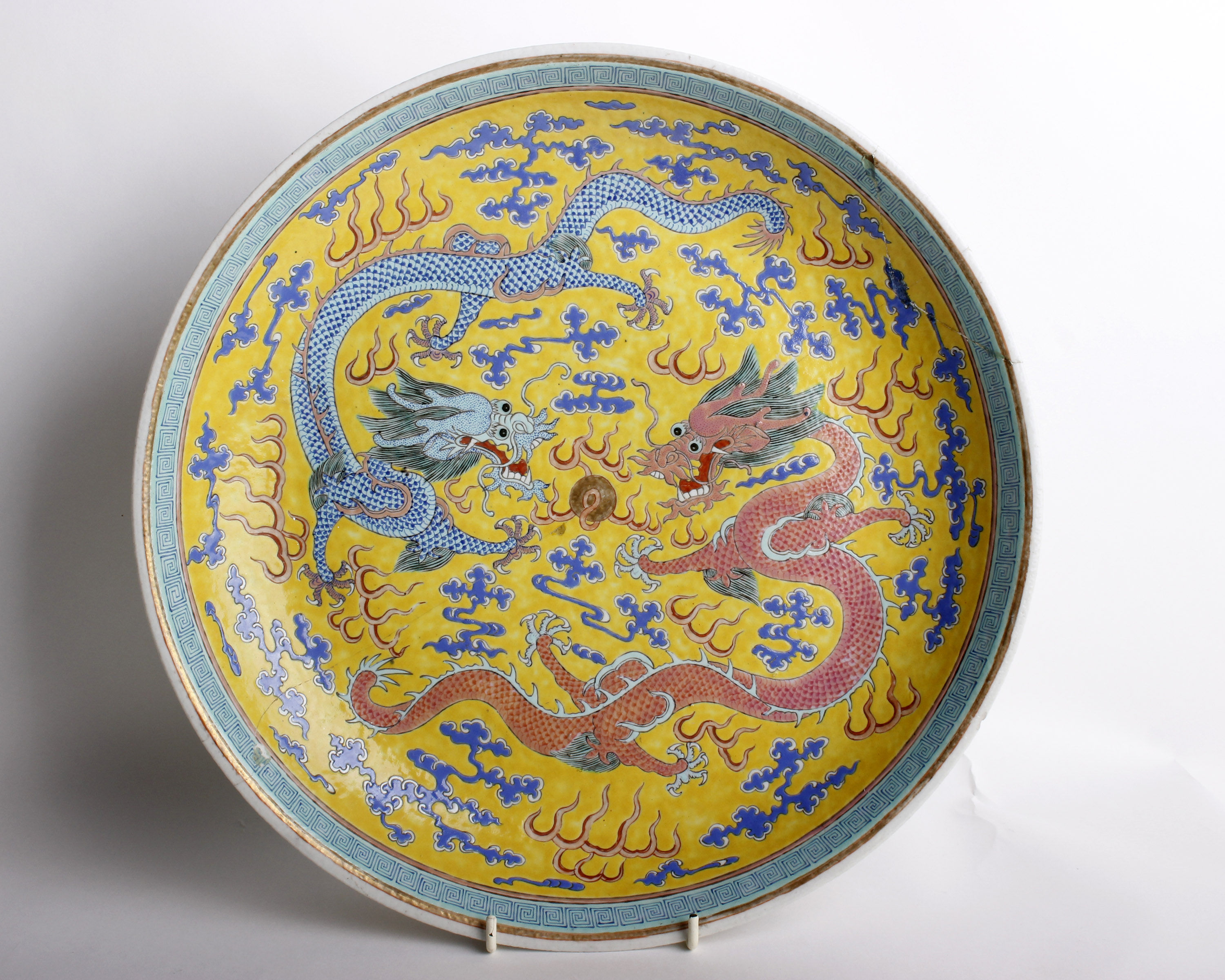 A Chinese Famille Jaune Porcelain Dragon DishHand painted in enamel in the famille jaune palette