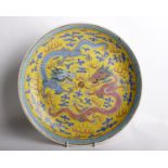 A Chinese Famille Jaune Porcelain Dragon DishHand painted in enamel in the famille jaune palette