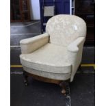 A Victorian Tub Chair In Jacquard Chenille Upholstery On Castors With carved, gilt feet and a walnut