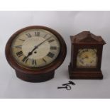 An early 20th century round faced wall clock of soft wood frame, 12-inch painted dial with Roman