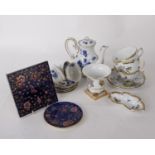 Zsolnay tile & saucer in blue glaze with pink and gold flowers, a blue and white teapot and 3 cups