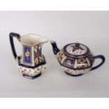 A Royal Winton Ivory Ware teapot complete with a matching jug. Both stamped to the base. H17cm (2)