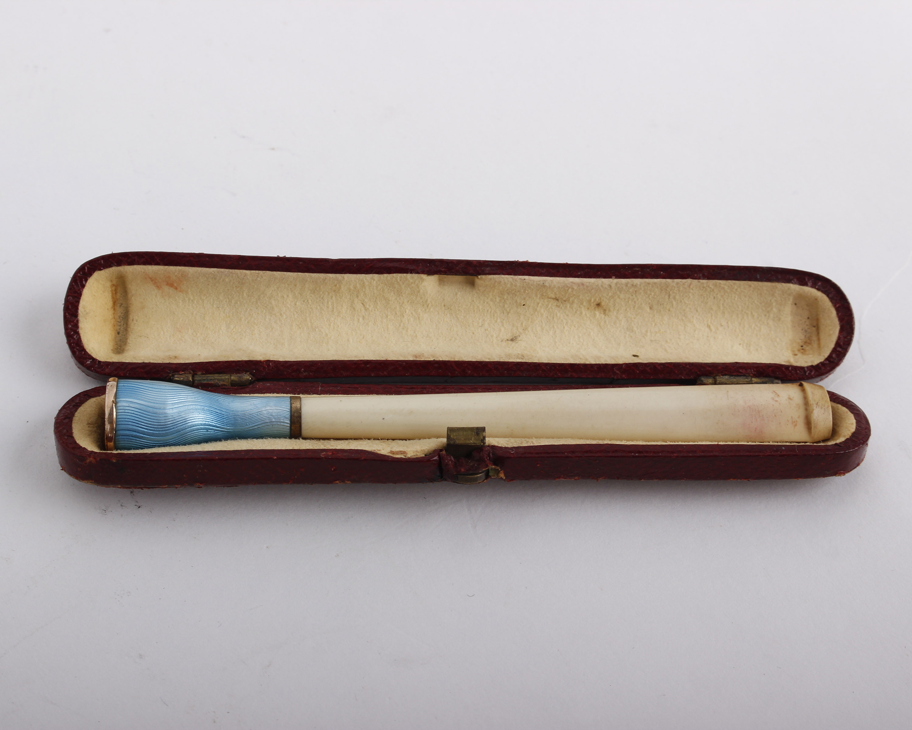 An enamel cigarette holder, with guilloche blue enamel, 9.7cm long; a cheroot holder; and a blue - Image 2 of 3