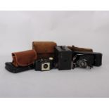 A Kodak No.1A Pocket camera, a Kodak No.2A Brownie and a Kodak Brownie 127 Camera.